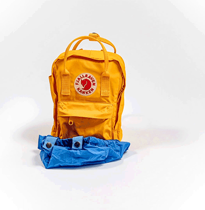 animated image of a yellow kanken being covered in a blue kanken cover