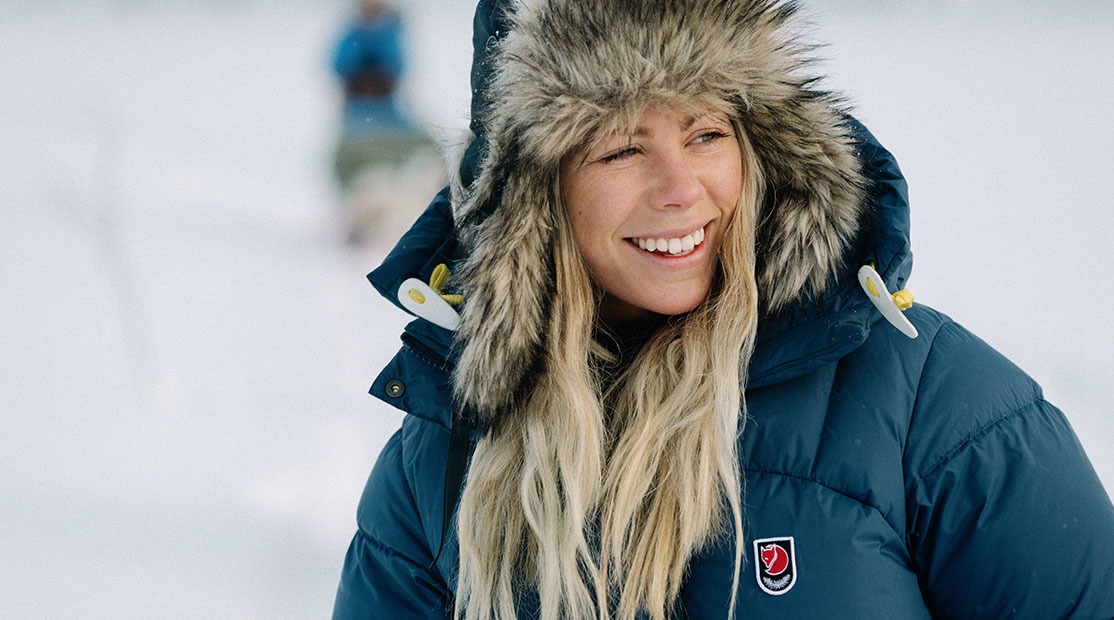 woman smiling wearing a Fjallraven parka