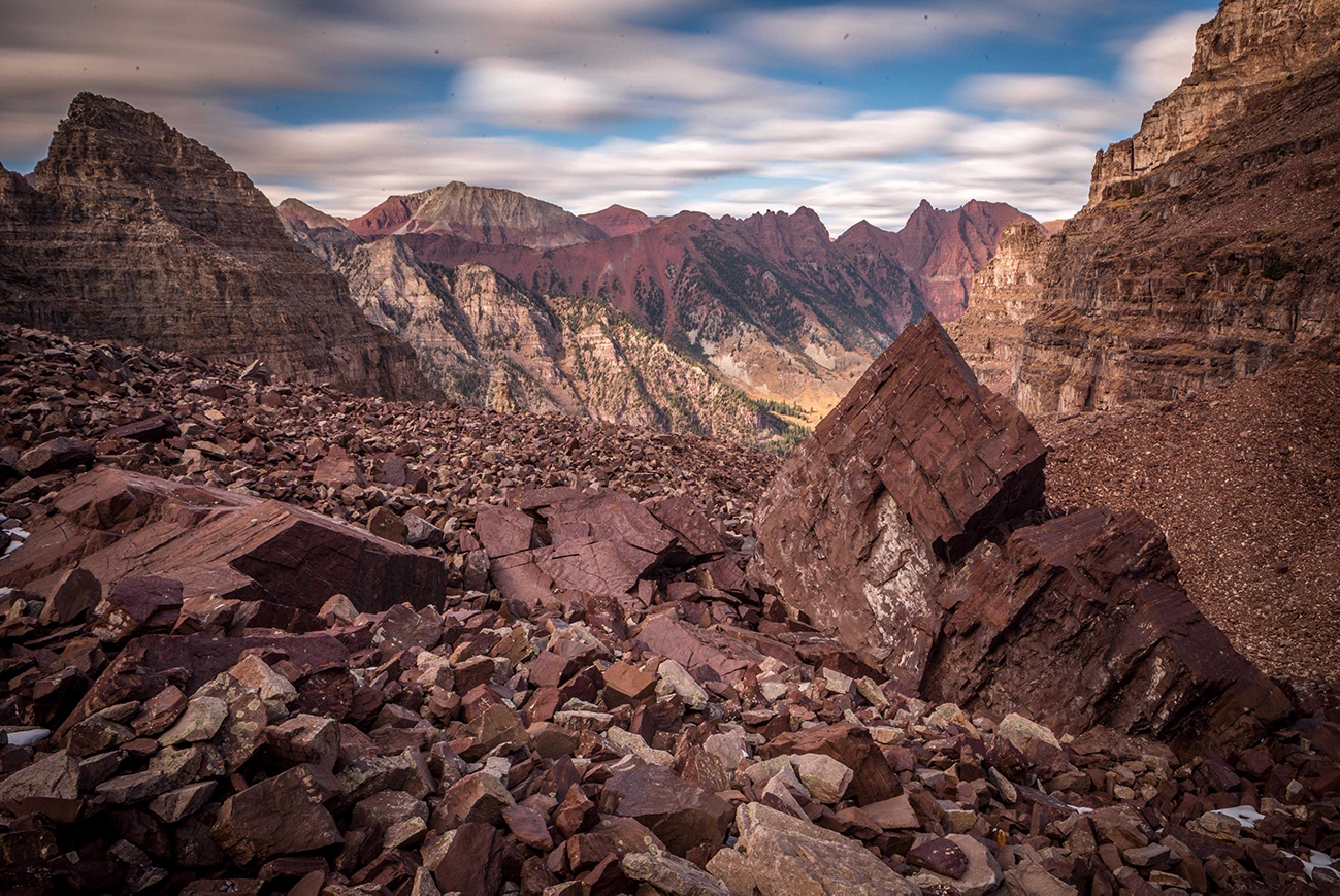 Chad Otterstrom layered mountain and canyon walls in red, gray, and brown.